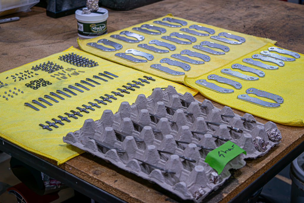 El Burrito knife parts prepared for assembly in the Turner CNC workshop